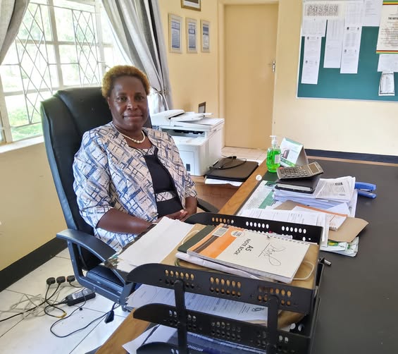 Head of Usher High School in the school office